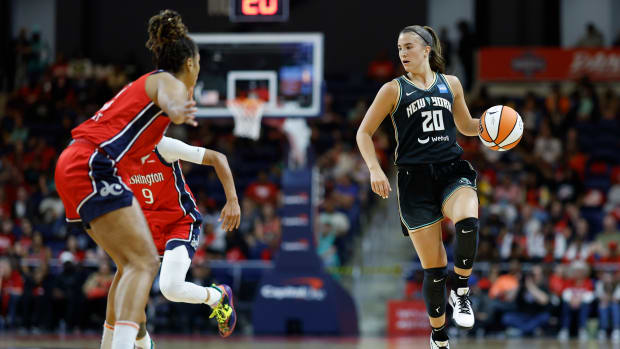 New York Liberty guard Sabrina Ionescu dribbles the basketball.
